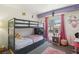 A bedroom with bunkbeds, pink accents, and themed decor at 2830 Crystal Lantern Dr, Henderson, NV 89074