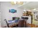 Charming dining area showcasing hardwood floors and an open layout connected to the kitchen at 2830 Crystal Lantern Dr, Henderson, NV 89074