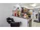 The kitchen features a breakfast bar, seamlessly connecting to the adjacent living spaces at 2830 Crystal Lantern Dr, Henderson, NV 89074