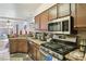 Well-lit kitchen boasts stainless steel appliances, a gas range, and ample counter space at 2830 Crystal Lantern Dr, Henderson, NV 89074