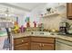 Kitchen featuring a double sink, granite countertops, and convenient breakfast bar seating at 2830 Crystal Lantern Dr, Henderson, NV 89074