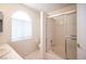 Bright bathroom featuring a vanity sink, toilet, and shower with glass doors at 2859 Palleta Dr, Henderson, NV 89074