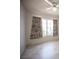 Bedroom with tile flooring, light walls, ceiling fan, and a window with patterned curtains at 2859 Palleta Dr, Henderson, NV 89074