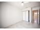 Bedroom with tiled floor, closet with white sliding doors, light walls, and ceiling fan at 2859 Palleta Dr, Henderson, NV 89074