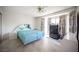 Bedroom with tiled floor, light walls, mirrored headboard, ceiling fan, and window at 2859 Palleta Dr, Henderson, NV 89074