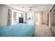 Bright bedroom with a ceiling fan, a window with curtains and sliding mirror door closet at 2859 Palleta Dr, Henderson, NV 89074