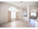 Spacious dining area connected to living room with a large decorative window at 2859 Palleta Dr, Henderson, NV 89074