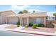 Well-maintained home featuring a tile roof, desert landscaping, and a two-car garage, situated on a quiet street at 2859 Palleta Dr, Henderson, NV 89074