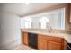 Open kitchen design featuring tile counters, wooden cabinets, and appliances at 2859 Palleta Dr, Henderson, NV 89074