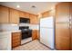 Traditional kitchen with wooden cabinetry and tile countertops at 2859 Palleta Dr, Henderson, NV 89074