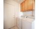 Laundry room with washer and dryer and white door to the garage at 2859 Palleta Dr, Henderson, NV 89074