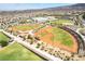 Aerial view of community baseball fields, grassy areas, and walking paths perfect for outdoor recreation at 2896 Grande Arch St, Henderson, NV 89044