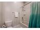 Neutral bathroom featuring a toilet, shower/bath combo and neutral shower curtain at 2896 Grande Arch St, Henderson, NV 89044