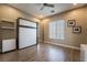 This bedroom features a murphy bed, wood floors and natural light from the large window at 2896 Grande Arch St, Henderson, NV 89044