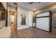 This bedroom features a murphy bed, wood floors and natural light from the large window at 2896 Grande Arch St, Henderson, NV 89044