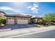 Beautiful single-story home featuring a three-car garage and a landscaped yard at 2896 Grande Arch St, Henderson, NV 89044