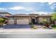 Charming single-story home featuring a three-car garage and manicured front yard at 2896 Grande Arch St, Henderson, NV 89044
