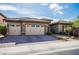 Charming single-story home with a brick driveway and a spacious three-car garage at 2896 Grande Arch St, Henderson, NV 89044