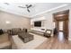 Modern living room featuring a ceiling fan, plank floors, and recessed lighting at 2896 Grande Arch St, Henderson, NV 89044