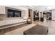 Open concept living room flows to kitchen with seamless design, modern finishes, and ample seating at 2896 Grande Arch St, Henderson, NV 89044