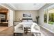 Bright bedroom featuring a king bed, stylish decor, and a window providing natural light at 2896 Grande Arch St, Henderson, NV 89044