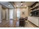 Office featuring hardwood floors, built-in shelving, and ample natural light at 2896 Grande Arch St, Henderson, NV 89044