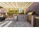 Outdoor kitchen featuring a grill, mini fridge, and lots of counter space at 2896 Grande Arch St, Henderson, NV 89044