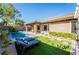 Inviting backyard pool and patio area with lounge chairs and manicured landscaping at 2896 Grande Arch St, Henderson, NV 89044