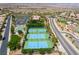 Overhead view of well-maintained tennis courts and recreational facilities, ideal for sports enthusiasts at 2896 Grande Arch St, Henderson, NV 89044