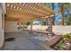 Covered patio with desert landscaping provides plenty of shade to relax and entertain at 2904 Channel Bay Dr, Las Vegas, NV 89128