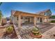 Relaxing backyard features a covered patio, desert landscaping, and ample space to entertain at 2904 Channel Bay Dr, Las Vegas, NV 89128