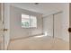 Clean bedroom offers neutral carpet, a window, and a closet for storage at 2904 Channel Bay Dr, Las Vegas, NV 89128