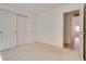 Bright bedroom featuring a large closet and neutral carpeting, offering a calm and serene atmosphere at 2904 Channel Bay Dr, Las Vegas, NV 89128