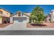 Charming single-story home featuring a well-maintained front yard and a two-car garage at 2904 Channel Bay Dr, Las Vegas, NV 89128