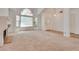 Bright living room featuring large windows and a fireplace at 2904 Channel Bay Dr, Las Vegas, NV 89128