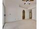 Spacious main bedroom featuring neutral carpeting, a ceiling fan, and access to an ensuite and closet at 2904 Channel Bay Dr, Las Vegas, NV 89128