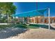 Community playground under a shade cover with a slide and soft play surface at 2904 Channel Bay Dr, Las Vegas, NV 89128