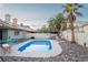 Backyard showcasing a refreshing pool, outdoor seating, and mature trees, perfect for relaxation at 3436 N Tenaya Way, Las Vegas, NV 89129