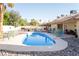 Backyard features a pool, desert landscaping and a large patio area perfect for entertaining at 3436 N Tenaya Way, Las Vegas, NV 89129