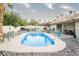 Inviting backyard featuring a refreshing pool, patio area, and colorful seating ideal for gatherings at 3436 N Tenaya Way, Las Vegas, NV 89129