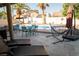 An inviting backyard pool area complete with lounge chairs, palm trees, and plenty of space for entertaining at 3436 N Tenaya Way, Las Vegas, NV 89129