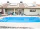 Backyard showcasing a pool and patio with seating, perfect for enjoying outdoor living and relaxation at 3436 N Tenaya Way, Las Vegas, NV 89129