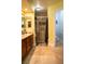 Bathroom with a vanity with double sinks, walk-in shower, toilet, and blue storage chest at 3436 N Tenaya Way, Las Vegas, NV 89129