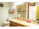 Modern bathroom with a granite countertop, dual sinks, and a large mirror with a shower view at 3436 N Tenaya Way, Las Vegas, NV 89129