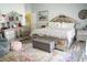 This bedroom has hardwood floors, a bed with a tufted headboard, and windows at 3436 N Tenaya Way, Las Vegas, NV 89129