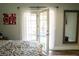 Bright bedroom featuring french doors leading to the backyard, letting in plenty of natural light at 3436 N Tenaya Way, Las Vegas, NV 89129