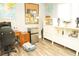 Bright bedroom features stylish decor, light wood floors and a cozy pet bed at 3436 N Tenaya Way, Las Vegas, NV 89129