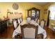 Dining room features a formal dining table and fireplace, perfect for entertaining guests at 3436 N Tenaya Way, Las Vegas, NV 89129
