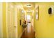 Hallway area with a gallery wall and hardwood floors adding a touch of sophistication at 3436 N Tenaya Way, Las Vegas, NV 89129
