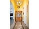 Bright hallway showcasing elegant tile accents, a wooden display cabinet, and decorative lighting at 3436 N Tenaya Way, Las Vegas, NV 89129